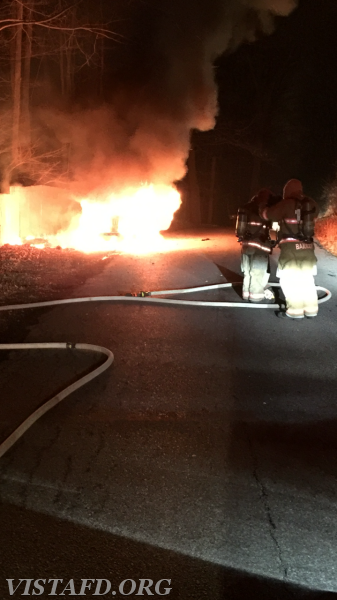 Vista Firefighters prepare to extinguish the fully involved car fire on Mill River Road - December 2015