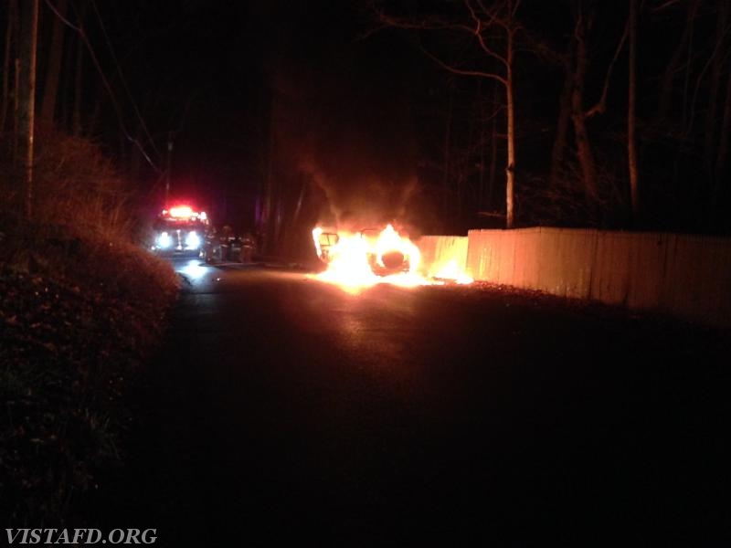 Vista Firefighters prepare to extinguish the fully involved car fire on Mill River Road - December 2015