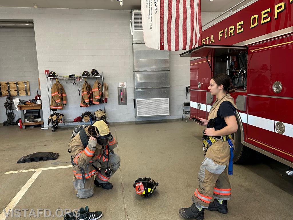 Probationary Firefighter Franco Compagnone conducting a &quot;2-minute drill&quot; as Firefighter/EMT Kyla Whalen times him during &quot;Firefighter Skills Class&quot; - 03/19/23