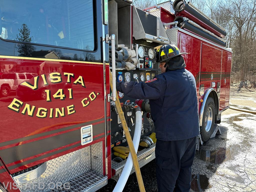Firefighter/EMT Ryan Huntsman operating the Engine 141 pump panel - 03/19/23