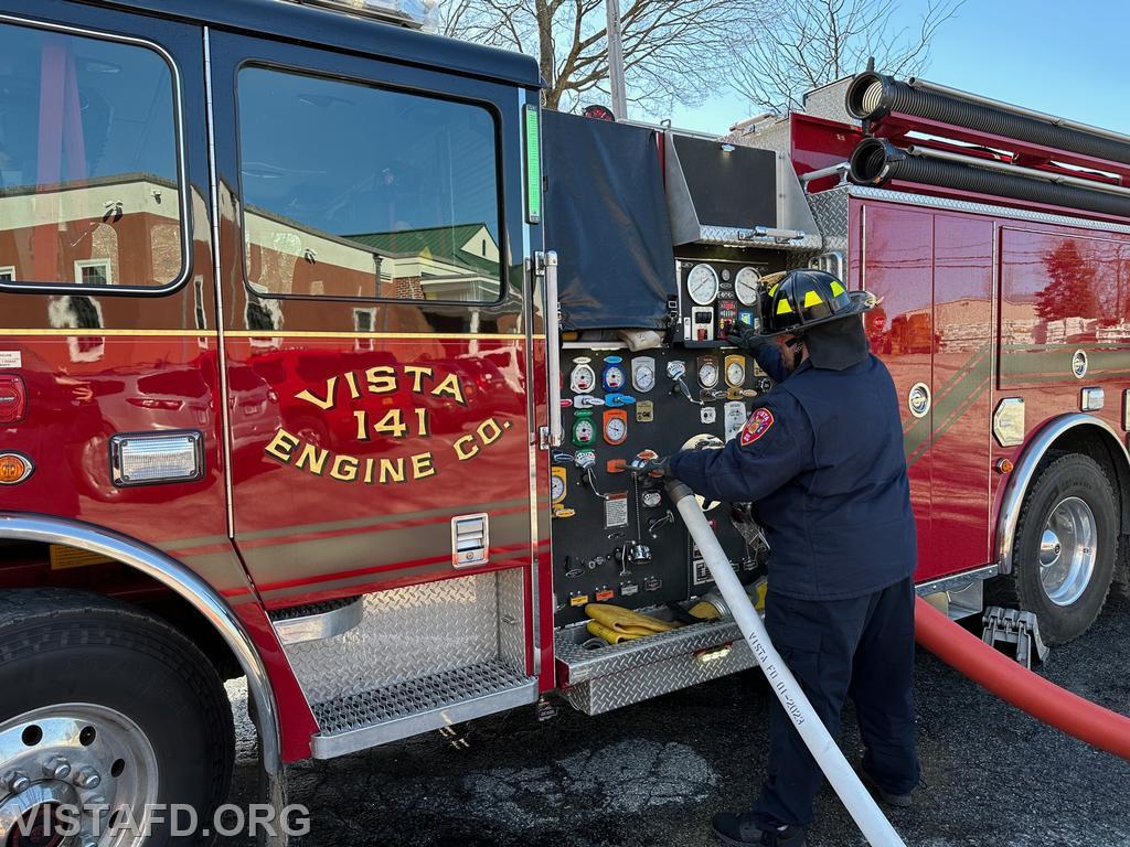 Firefighter/EMT Ryan Huntsman operating the Engine 141 pump panel - 04/02/23