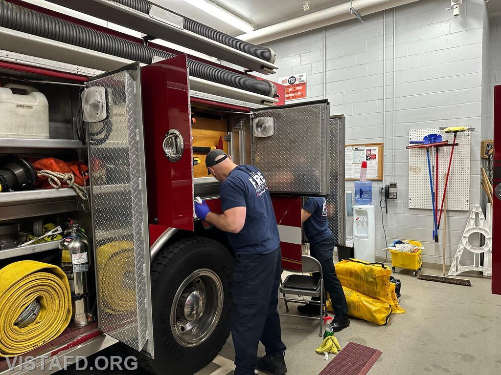 Captain Marc Baiocco and Foreman Kyla Whalen cleaning Engine 143 - 05/22/23