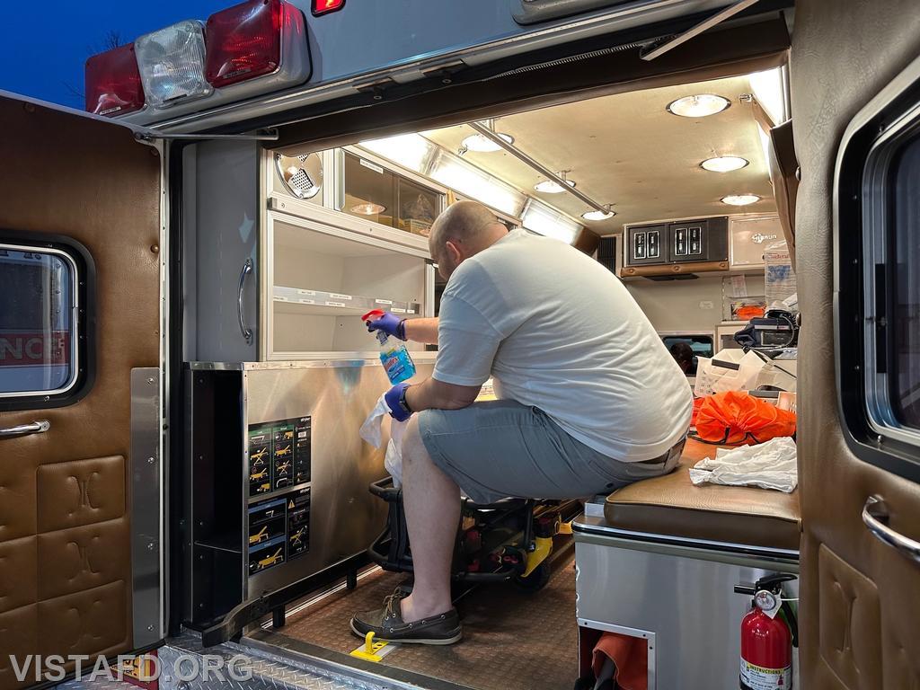 Firefighter/EMT Ryan Huntsman cleaning Ambulance 84B2 - 05/22/23