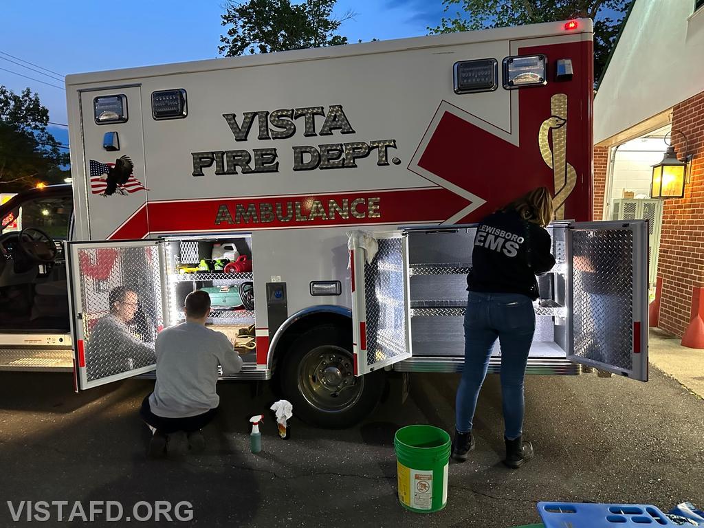 Assistant Chief Brian Porco and Foreman Isabel Fry cleaning Ambulance 84B1 - 05/22/23