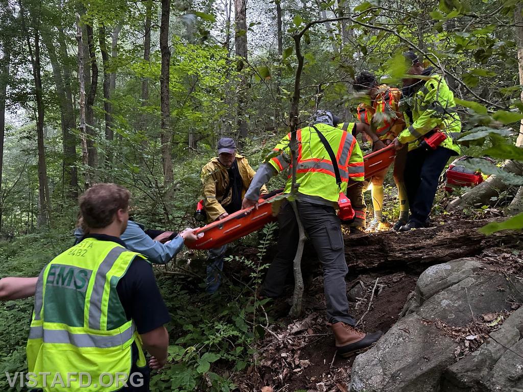 Vista Fire Department, South Salem Fire Department and Lewisboro Volunteer Ambulance Corps personnel extricating the hiker from the Leon Levy Preserve - 06/12/23