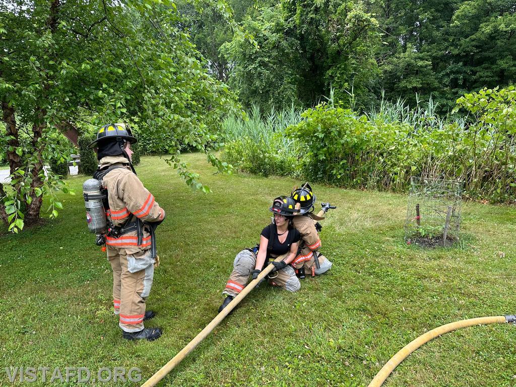Foreman Kyla Whalen going over how to operate an 1-3/4&quot; hoseline with Probationary Firefighter Ty Graygor - 07/02/23