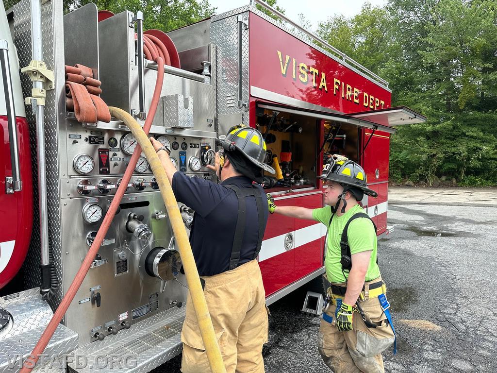 Firefighter Mark Albert going over how to operate the Engine 142 pump panel with Foreman Ryan Ruggiero - 07/02/23