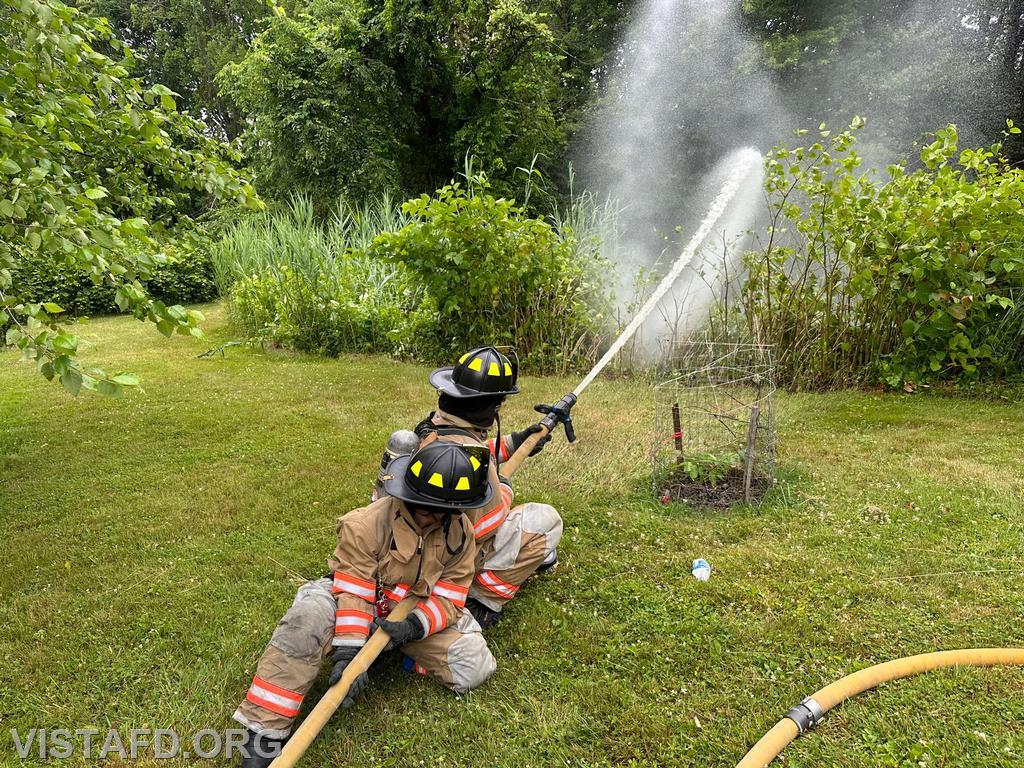Probationary Firefighter Ty Graygor and Foreman Kyla Whalen operating an 1-3/4&quot; hoseline - 07/02/23