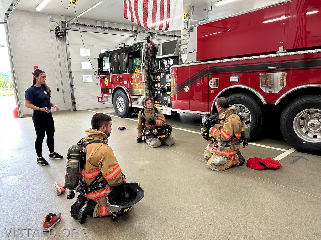 Firefighter Phil Katz and Foreman Kyla Whalen going over the &quot;25 second drill&quot; during &quot;Firefighter Skills Class&quot; - 07/16/23