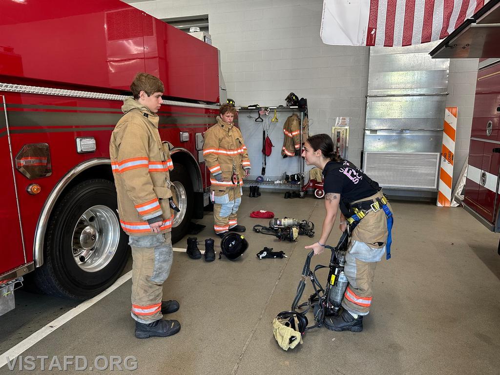 Foreman Kyla Whalen going over the SCBA with Probationary Firefighter Guillaume Pestie and FF/EMT Ian Ferman - 07/23/23