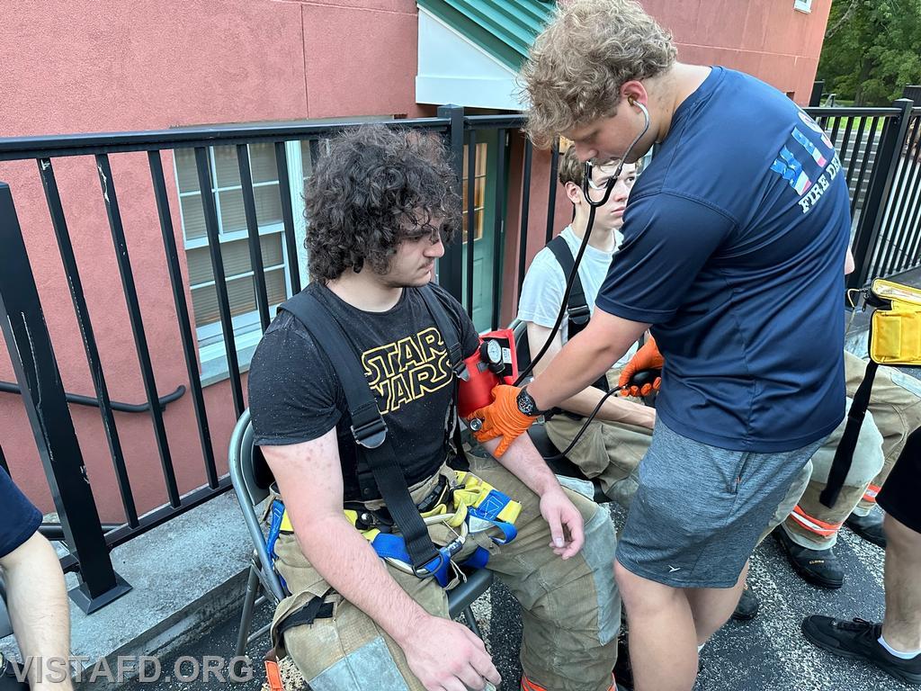 EMT Ian Ferman conducting rehab operations on Probationary Firefighter Franco Compagnone - 07/24/23