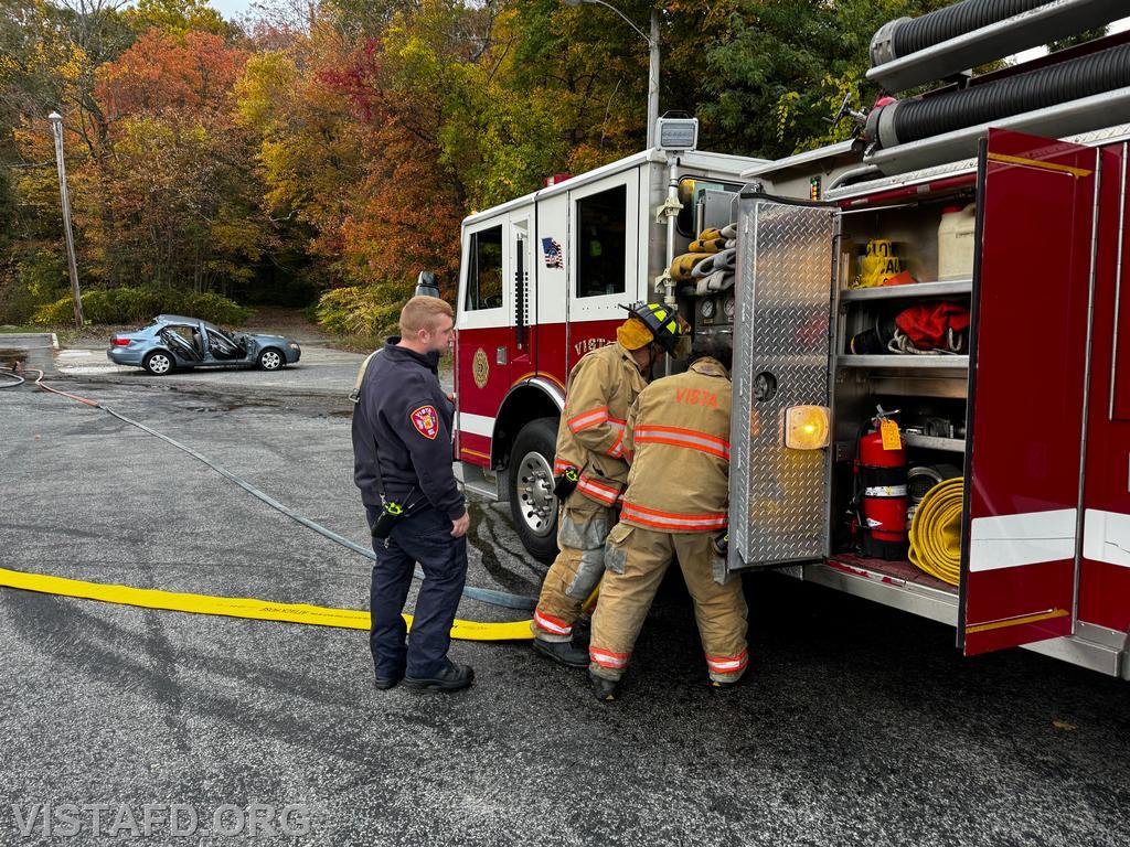 Probationary Firefighter Peter Cipriano and Probationary Firefighter Dan Hochman operating the E-143 pump panel as Lead Foreman Mike Peck looks on - 10/13/24