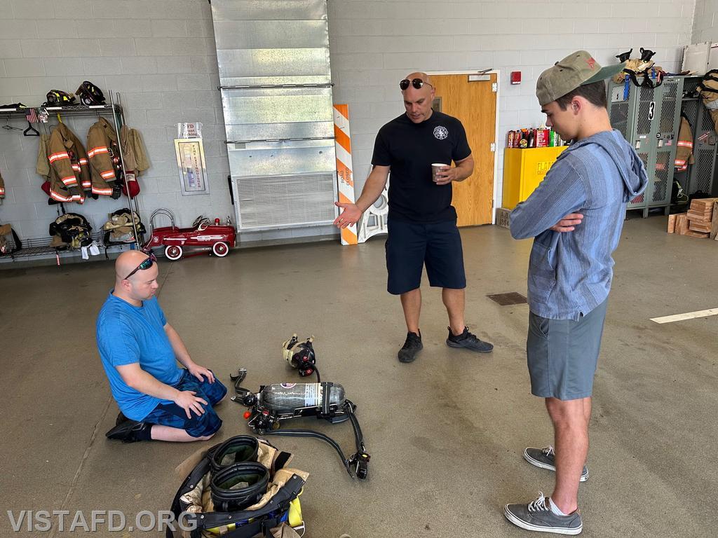 Foreman Ryan Ruggiero and Captain Marc Baiocco going over an SCBA with Probationary Firefighter Teddy Goetz - 09/03/23