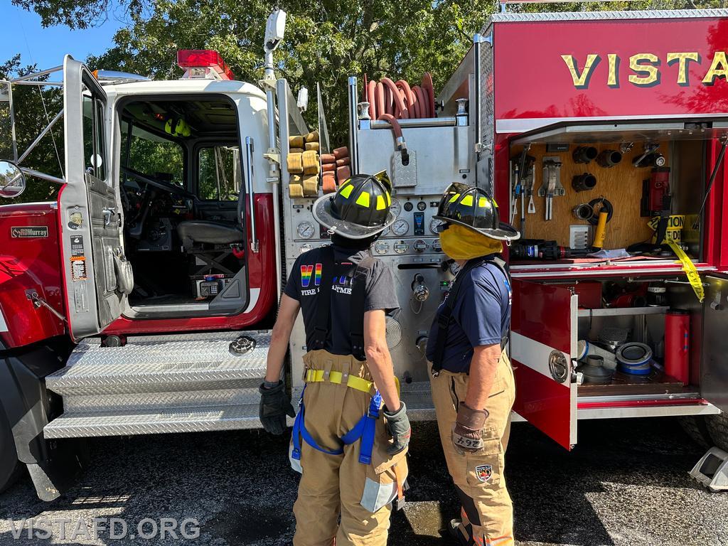 Foreman Brian Sferra going over the Engine 142 pump panel with Probationary Firefighter/EMT Candidate Andy Korman - 10/01/23