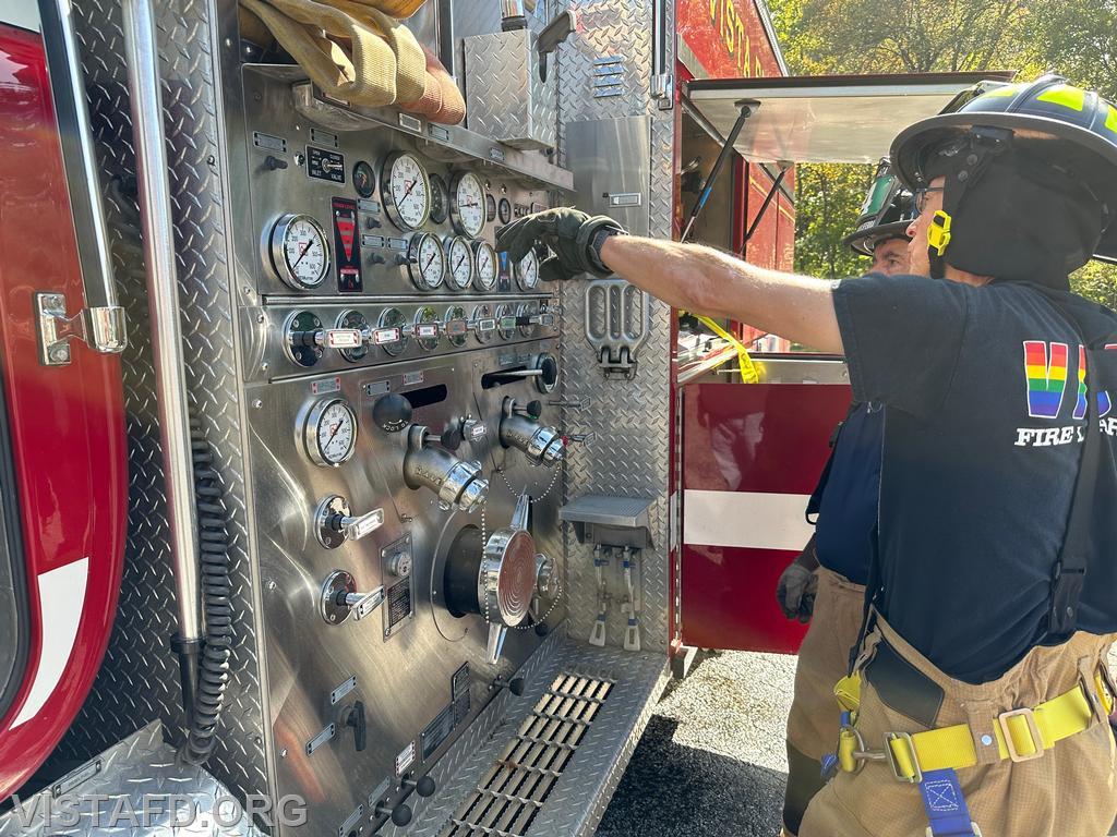 Foreman Brian Sferra going over the Engine 142 pump panel with Probationary Firefighter/EMT Candidate Andy Korman - 10/01/23