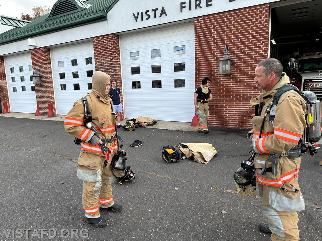 Firefighter Phil Katz going over how to use an SCBA with Probationary Firefighter Teddy Goetz - 10/15/23