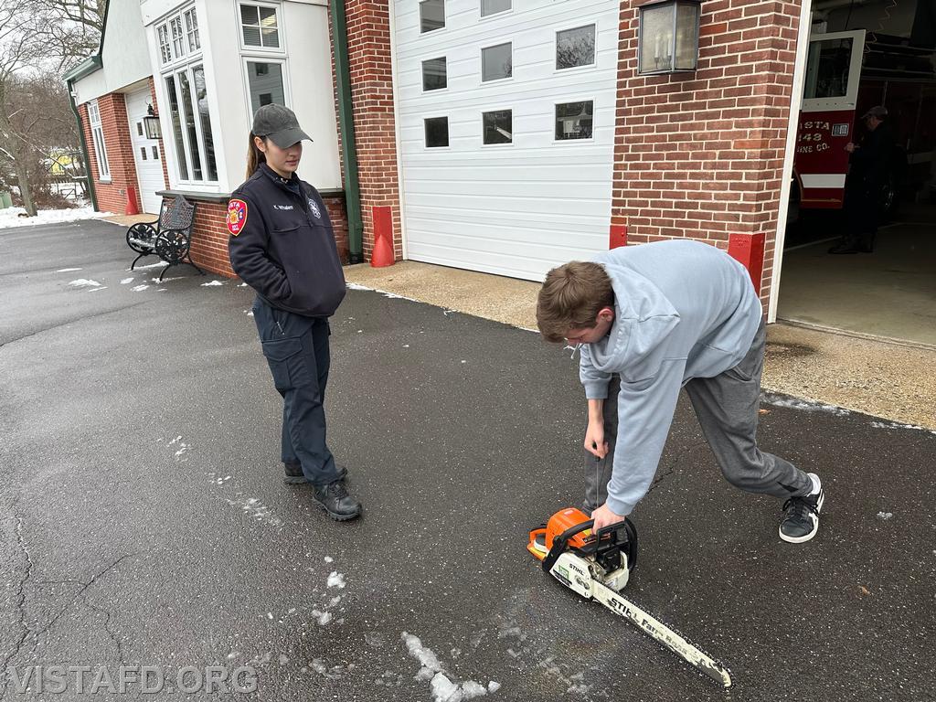 Foreman Kyla Whalen going over how to operate the chainsaw with Probationary Firefighter Guillaume Pestie - 01/07/24
