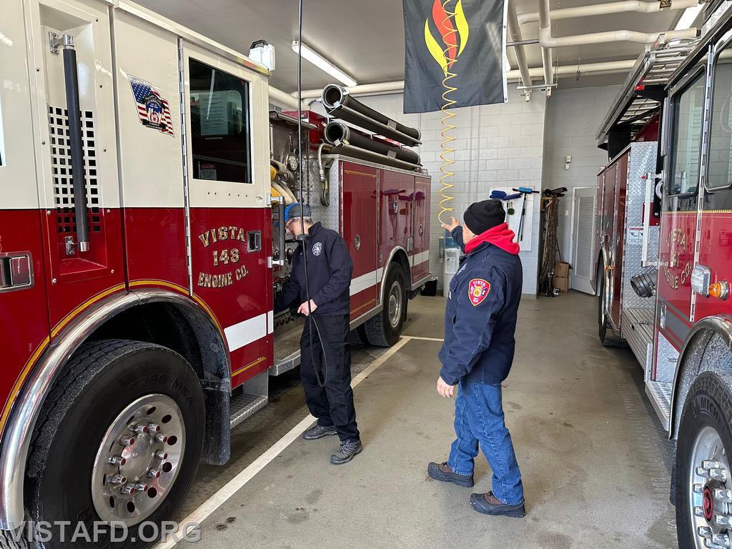 Firefighter Martin Rojas and FF/EMT Candidate Andy Korman doing a walk around check of Engine 143 before conducting driver training - 01/21/24