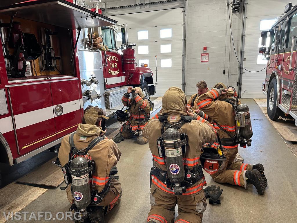 Foreman Kyla Whalen going over how to put on an SCBA during &quot;Firefighter Skills Class&quot; - 02/18/24
