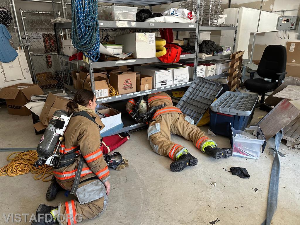 Foreman Kyla Whalen going over an SCBA reduced profile during &quot;Firefighter Skills Class&quot; - 02/18/24