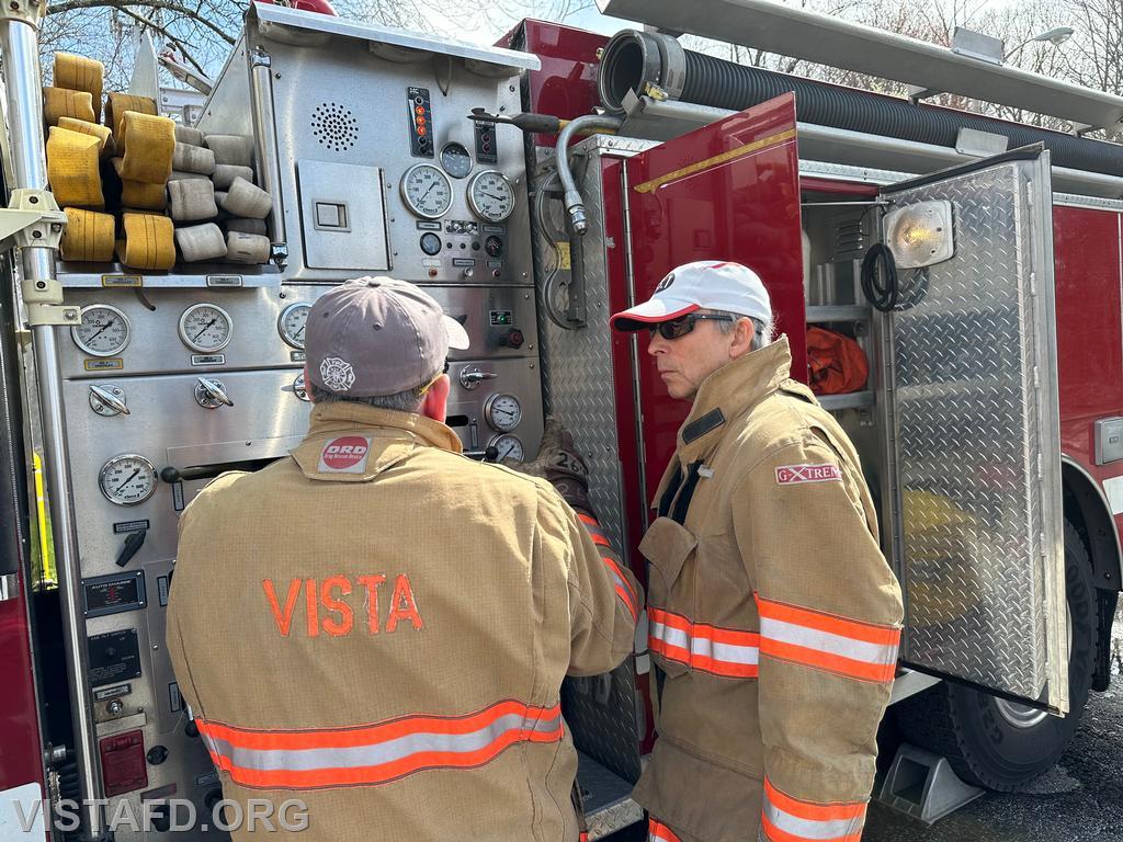 Foreman Brian Sferra going over how to operate the Engine 143 pump panel with FF/EMT Candidate Andy Korman - 04/14/24