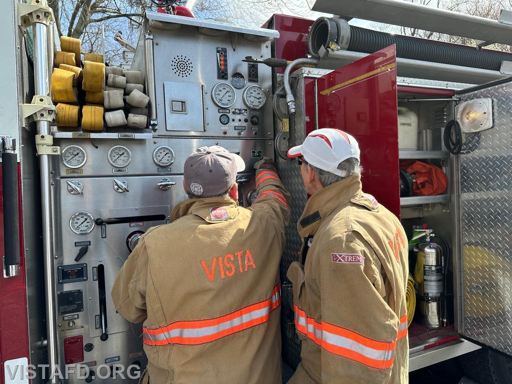 Foreman Brian Sferra going over how to operate the Engine 143 pump panel with FF/EMT Candidate Andy Korman - 04/14/24