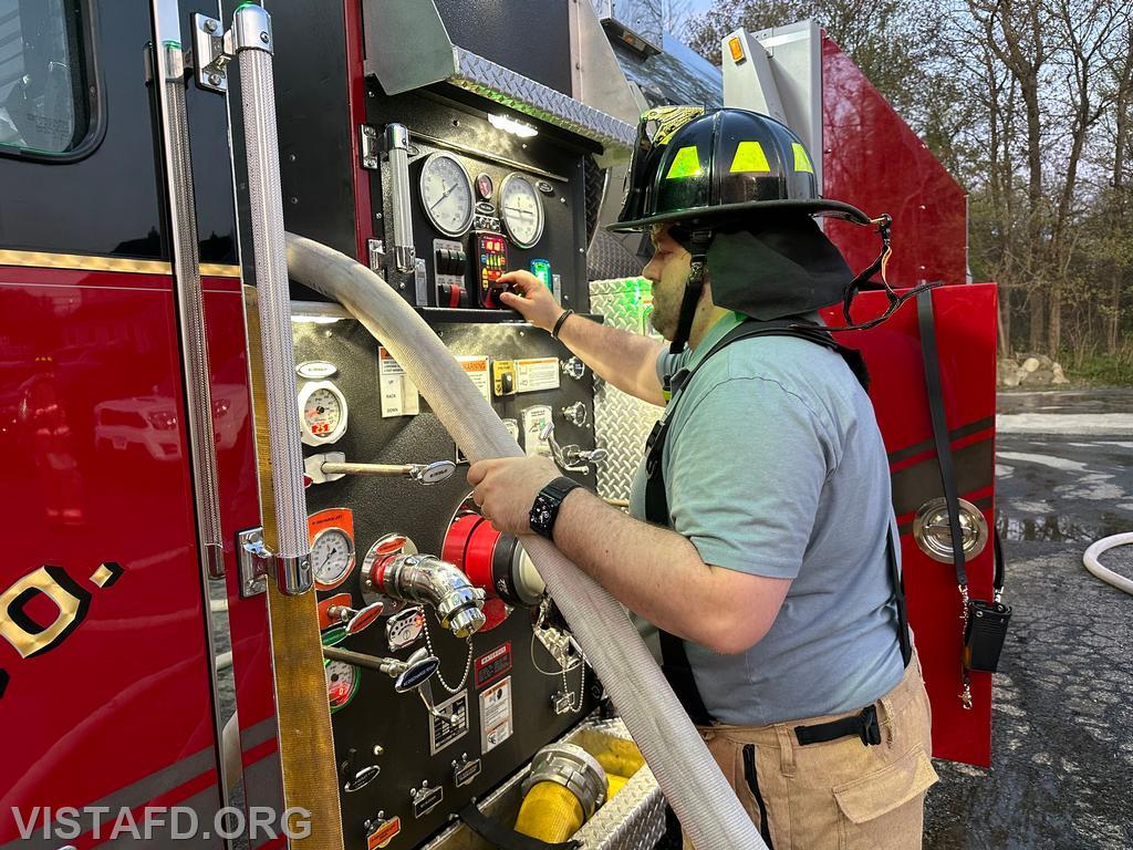 Firefighter/EMT Ryan Huntsman operating the Tanker 4 pump panel - 04/29/24