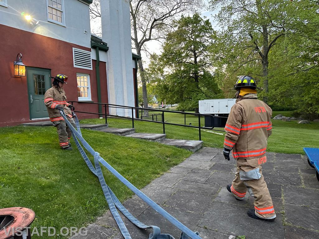 Probationary Firefighter Guillaume Pestie practicing how to stretch an 1-3/4&quot; hoseline - 05/13/24
