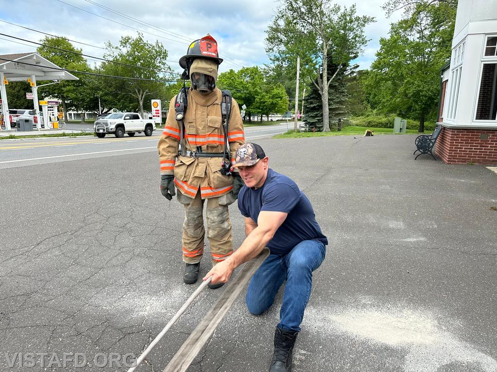 Captain Marc Baiocco going over the Task Oriented Air Consumption (TOAC) course with Probationary Firefighter Guillaume Pestie  - 05/19/24