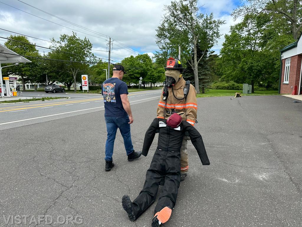 Probationary Firefighter Guillaume Pestie going through the Task Oriented Air Consumption (TOAC) course as Captain Marc Baiocco looks on - 05/19/24