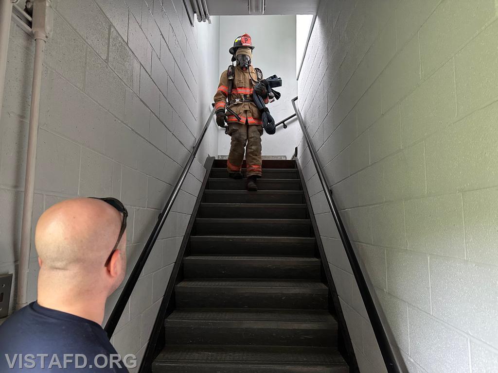 Probationary Firefighter Guillaume Pestie going through the Task Oriented Air Consumption (TOAC) course as Foreman Ryan Ruggiero looks on - 05/19/24