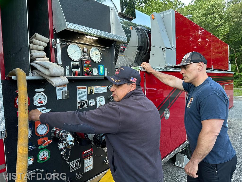 Firefighter Martin Rojas practicing how to operate the Tanker 4 pump panel as Captain Marc Baiocco looks on - 06/10/24