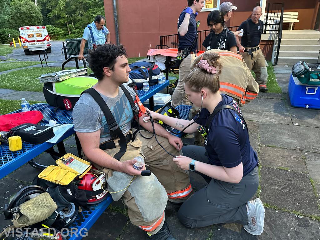 Foreman Isabel Fry conducting rehab operations on Probationary Firefighter Franco Compagnone - 06/17/24