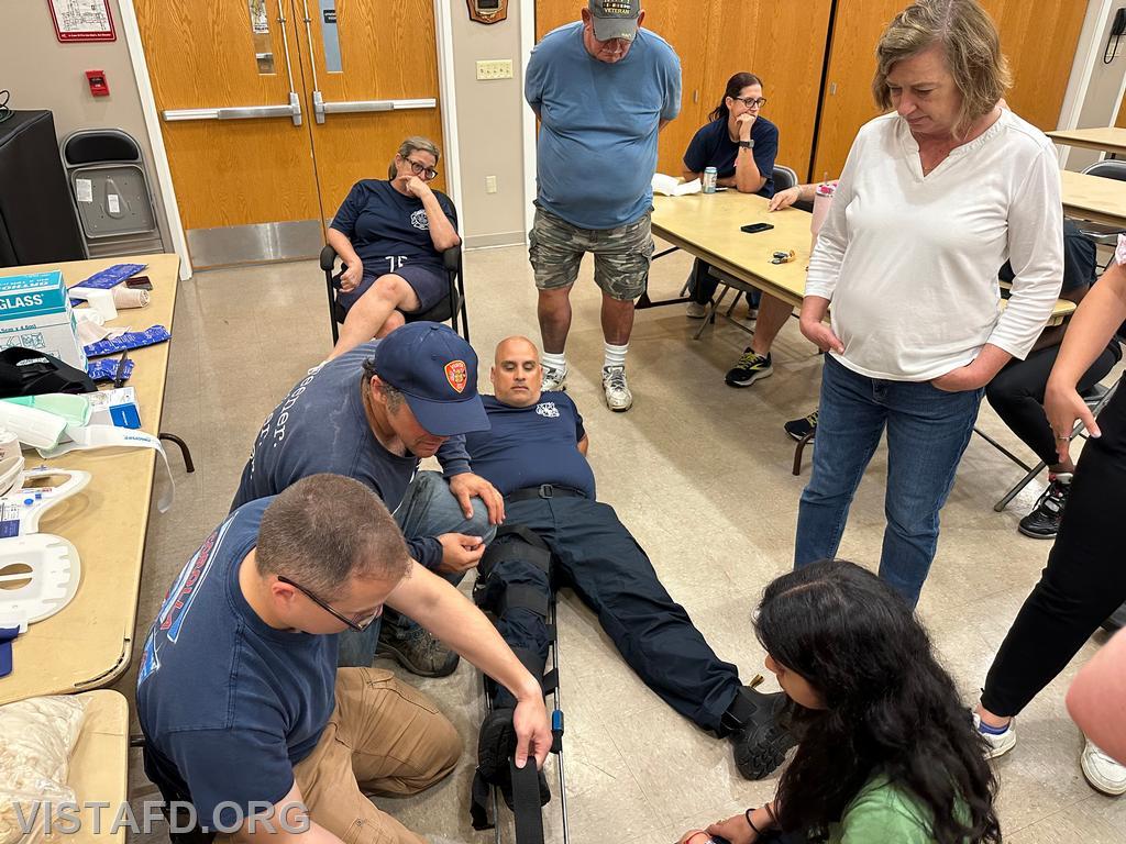 Vista EMS personnel conducting splinting techniques as Barbara Polowczyk looks on - 08/19/24