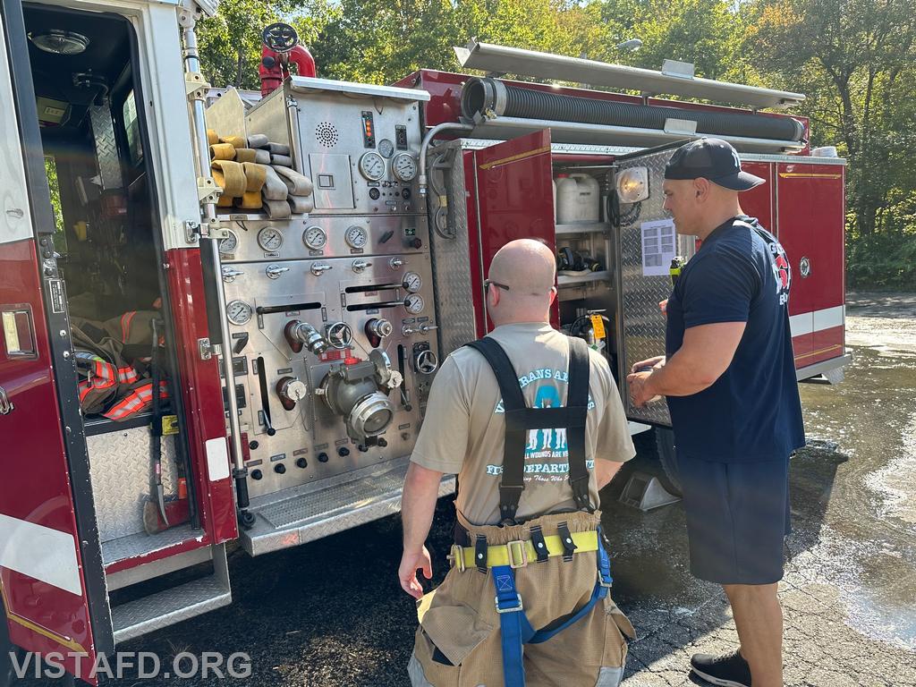 Captain Marc Baiocco explaining the Engine 143 pump panel to Foreman Ryan Ruggiero - 09/15/24