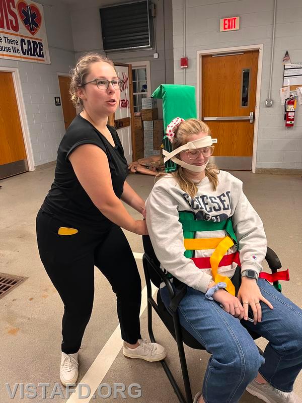 Lt. Elly Hersam and Foreman Isabel Fry going over how to use the Kendrick extrication device (KED) - 09/16/24