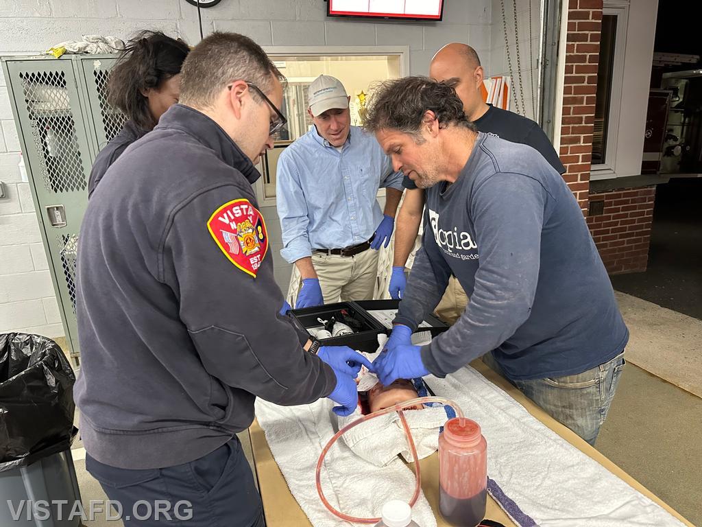 Probationary Firefighter Peter Cipriano going over how to pack a wound as Assistant Chief Brian Porco looks on - 09/23/24