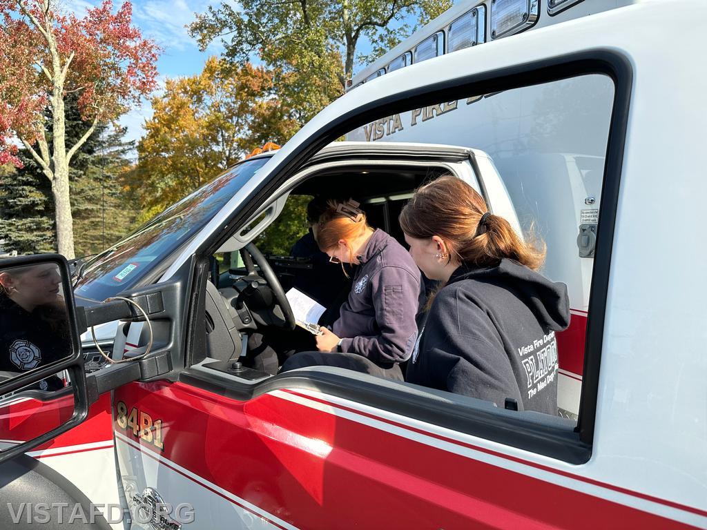 Foreman Isabel Fry going over Ambulance 84B1 with Probationary EMT Amanda Aalto and Probationary EMT Candidate Axel Pestie - 10/13/24