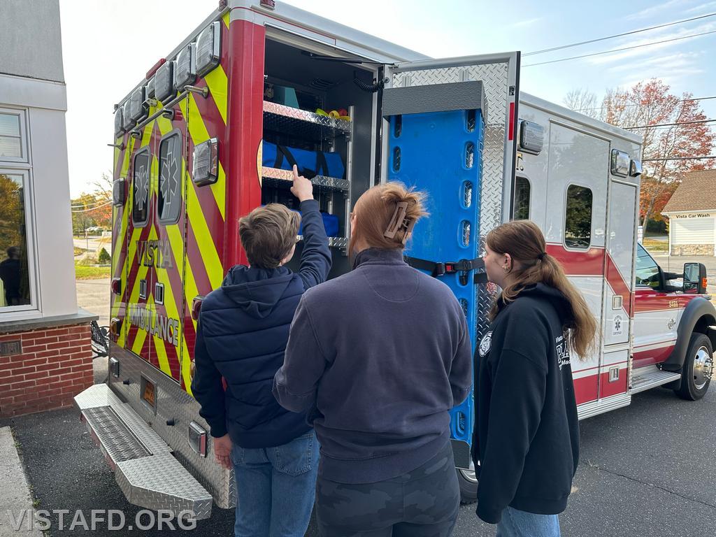 Foreman Isabel Fry going over Ambulance 84B1 with Probationary EMT Amanda Aalto and Probationary EMT Candidate Axel Pestie - 10/13/24