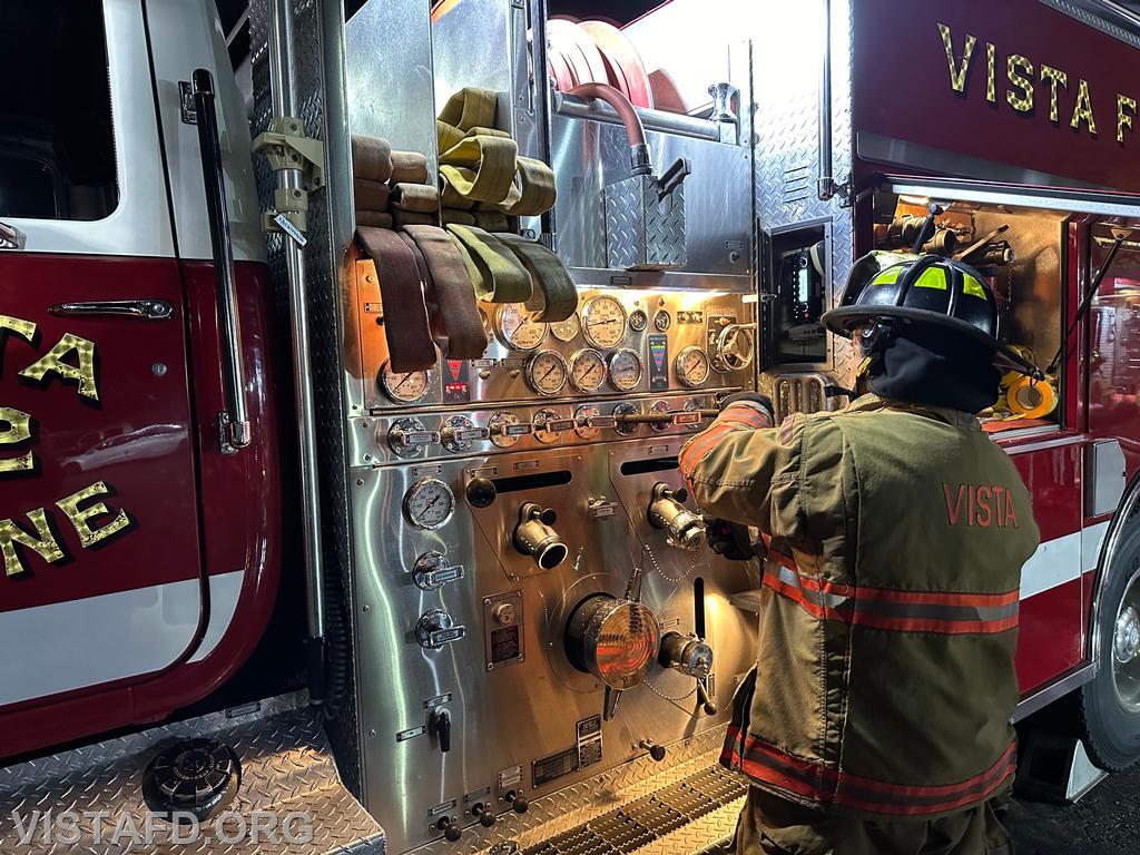 Probationary Firefighter Peter Cipriano operating the Engine 142 pump panel during the &quot;tanker shuttle&quot; drill - 10/14/24