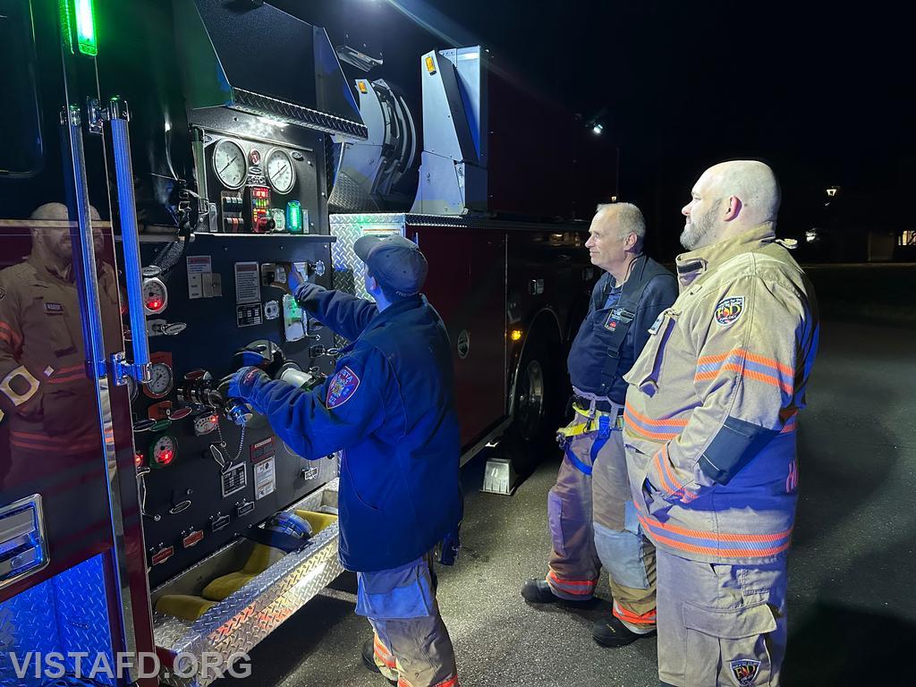 Firefighter Dom Mangone operating the Tanker 4 pump panel during a hydrant service as Ex-Chief Bill Dingee and FF/EMT Ryan Huntsman look on - 11/25/24