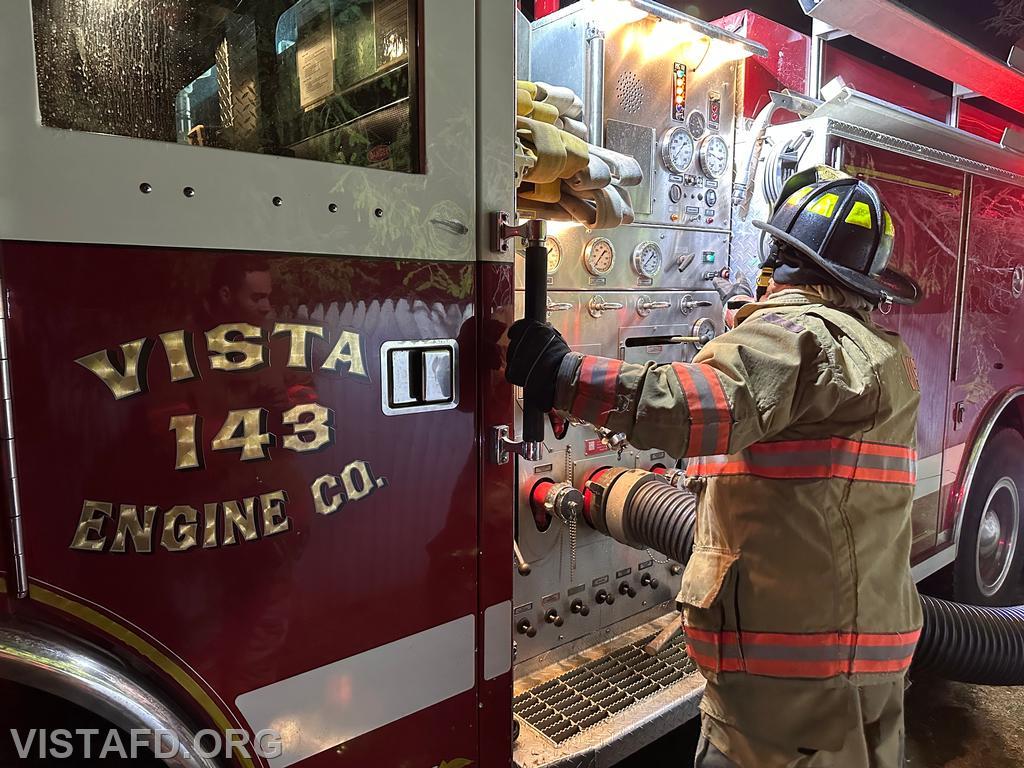 Firefighter Peter Cipriano operating the Engine 143 pump panel during a hydrant service - 11/25/24