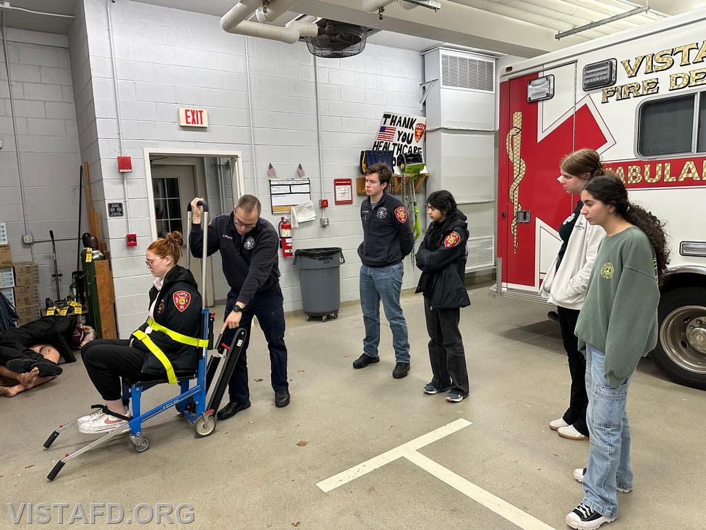 Assistant Chief Brian Porco going over how to operate the stair chair during the &quot;lifting & moving&quot; drill - 11/25/24