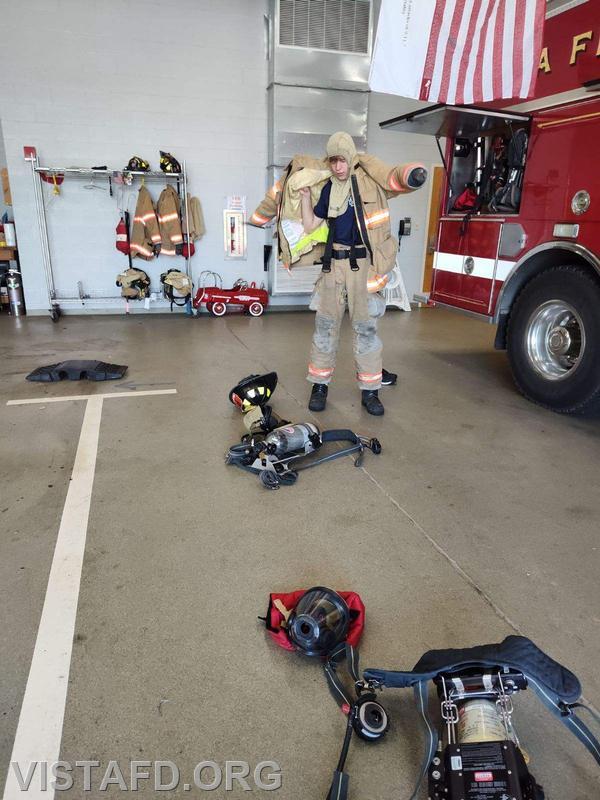 Probationary Firefighter Guillaume Pestie donning his firefighting gear - 08/13/23