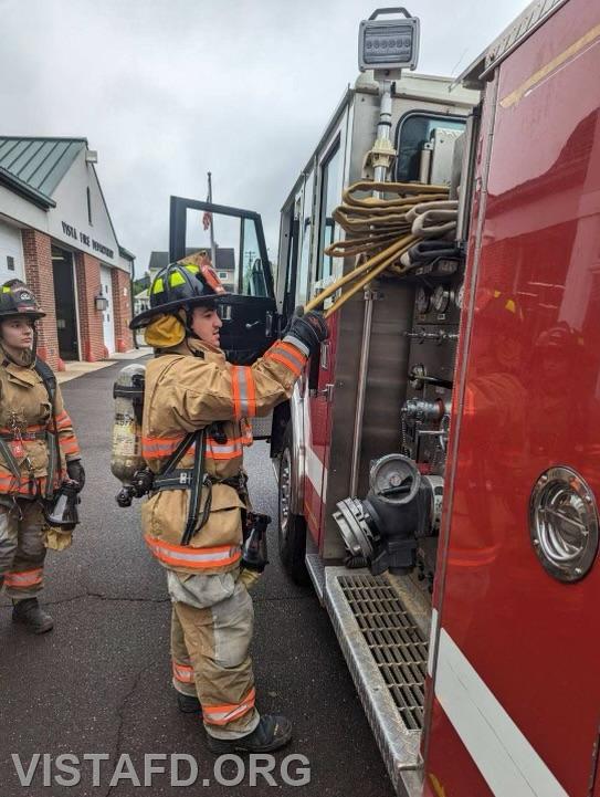 Probationary Firefighter Franco Compagnone practicing how to stretch an 1-3/4&quot; hoseline as FF/EMT Kyla Whalen looks on - 04/16/23