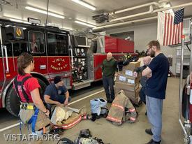 Captain Marc Baiocco reviewing firefighting gear during the "Firefighter Skills Class"